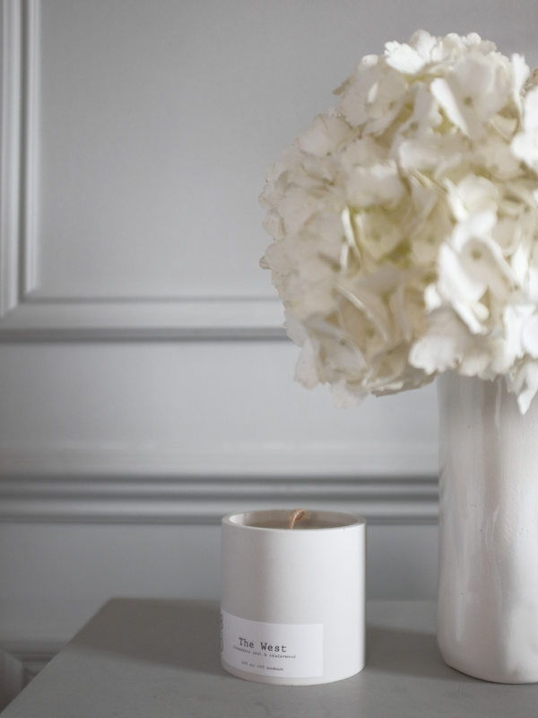 Cosy corner styled with linen throw and candle